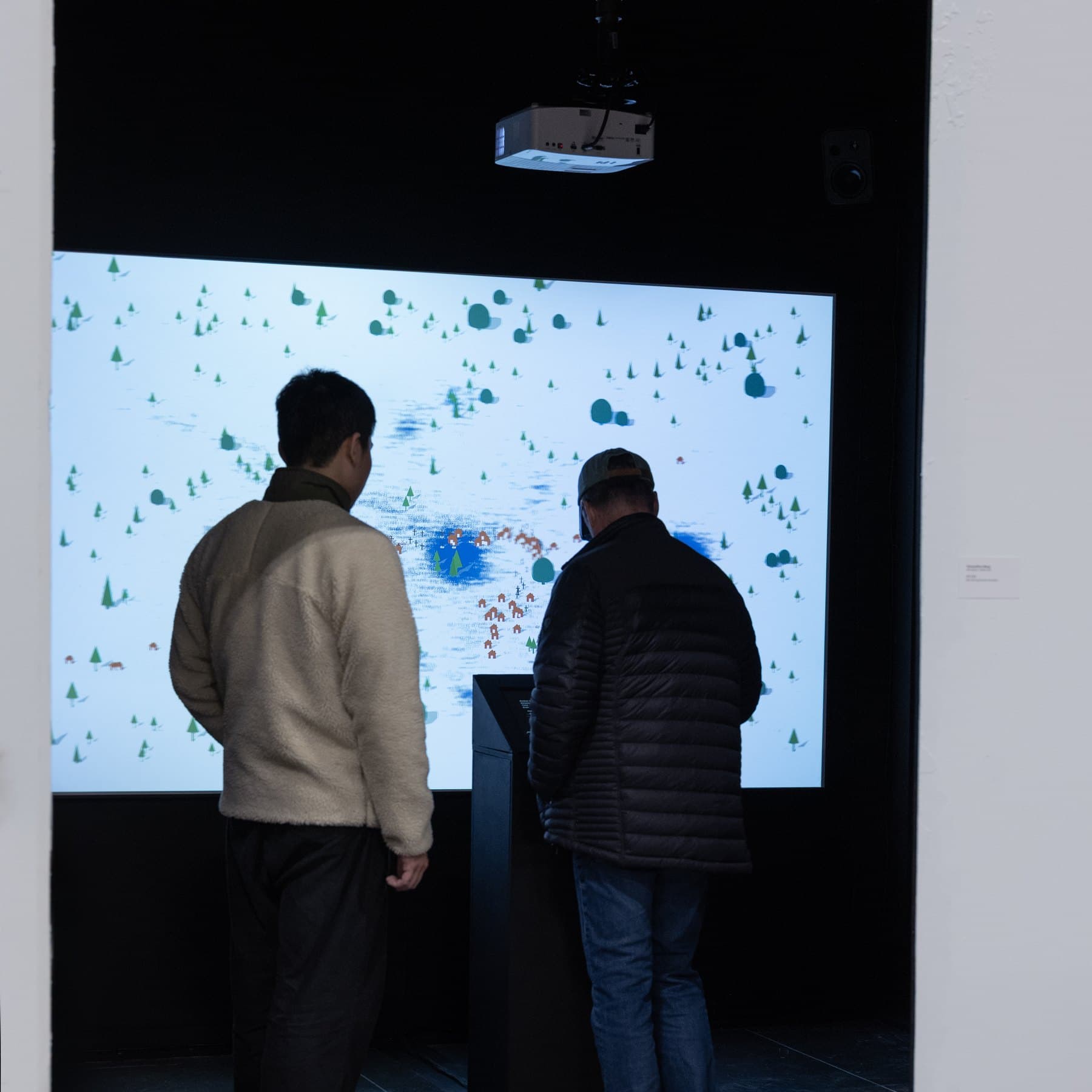 Two visitors at the plinth